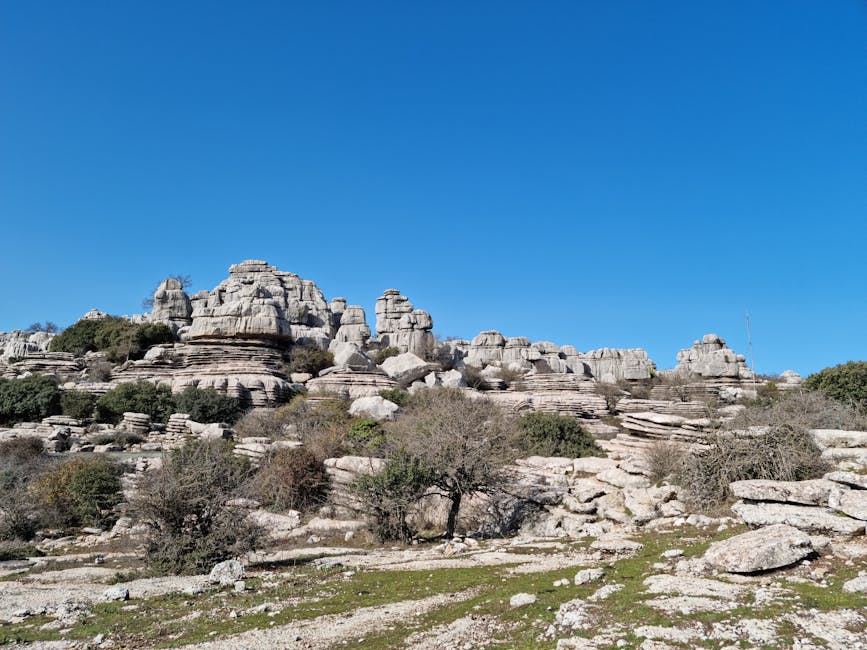 Stunning karst formations under a bright blue sky in El Torcal de Antequera.
