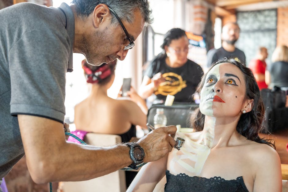 Artist applying Catrina makeup in Mexico City, capturing the essence of Day of the Dead traditions.