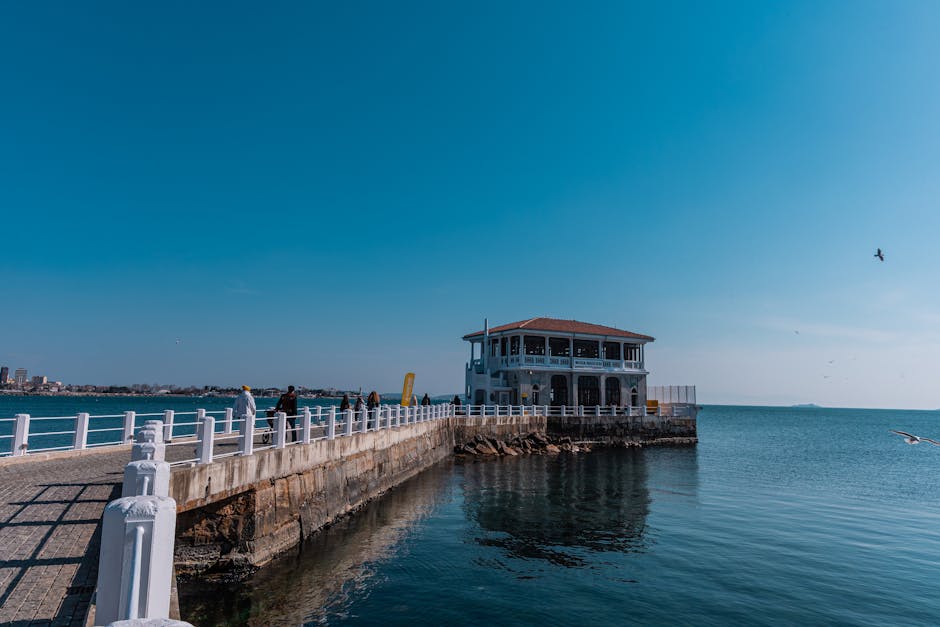 A picturesque view of Moda Pier in Istanbul with clear skies and the calm sea.